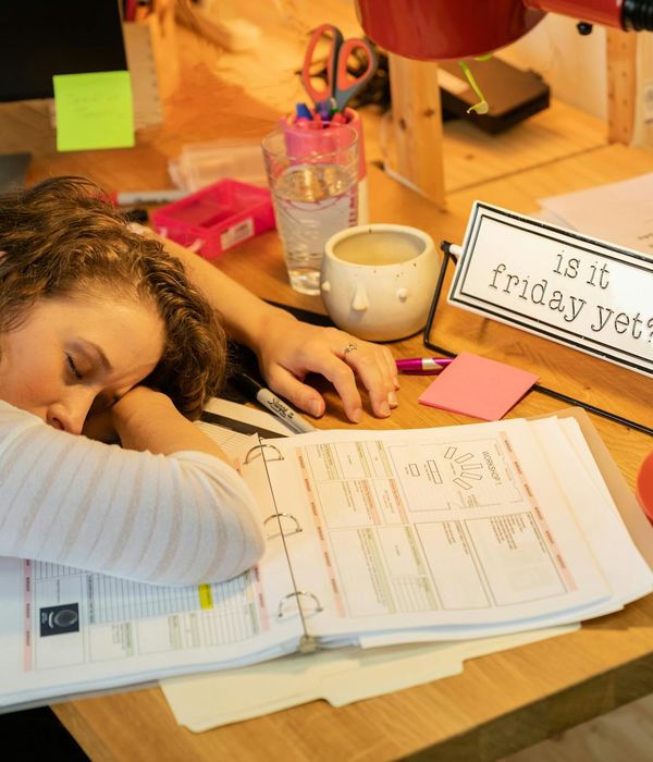 Person resting eyes during a work break in office